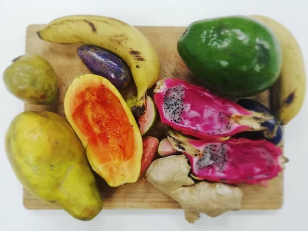 Variety of fruits on a wooden cutting board