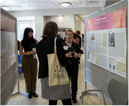 People standing at a presentation board